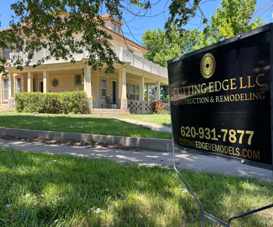 Cutting Edge Hutchinson Kansas Construction and Remodeling sign in happy customer's yard